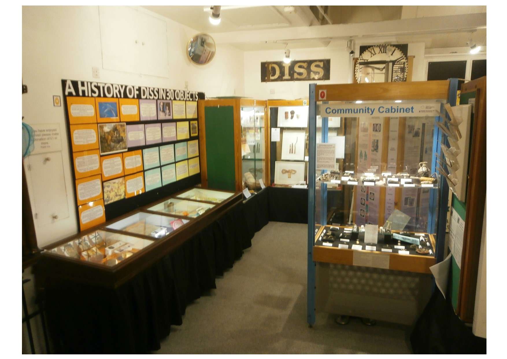 Museum display cases featuring local history artefacts and exhibits.