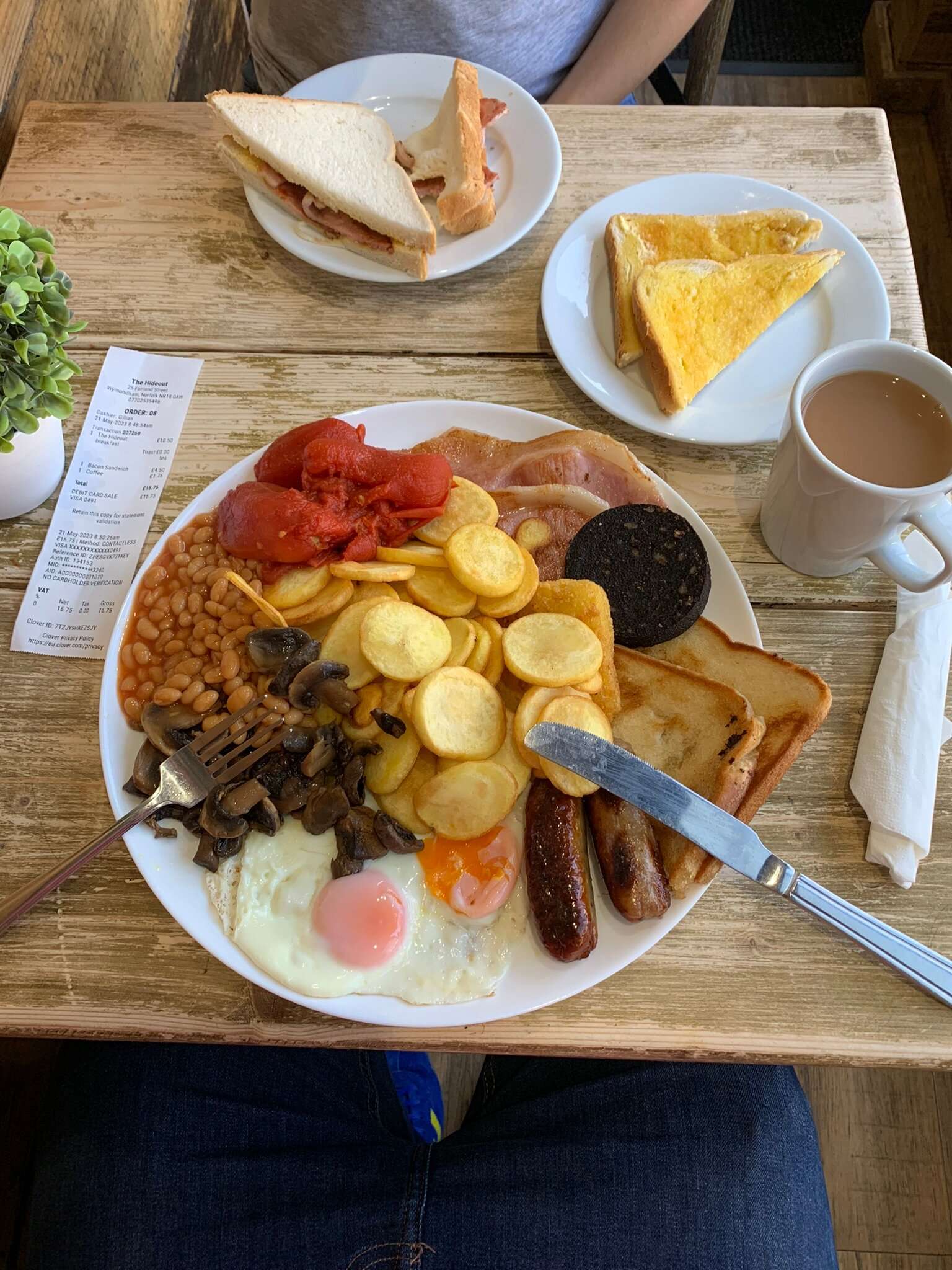 Full English breakfast with toast, eggs, mushrooms, black pudding and a hot drink served at The Hideout.